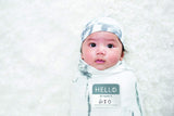 lulujo Birth Announcement Hat & Swaddle Blanket Set| Unisex Softest Bamboo Muslin Baby Swaddle Blanket| Neutral Receiving Blanket | 47in x 47in| Bamboo Knot Hat | Hello! Birth Announcement Sticker