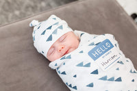 lulujo Birth Announcement Hat & Swaddle Blanket Set| Unisex Softest Bamboo Muslin Baby Swaddle Blanket| Neutral Receiving Blanket | 47in x 47in| Bamboo Knot Hat | Hello! Birth Announcement Sticker